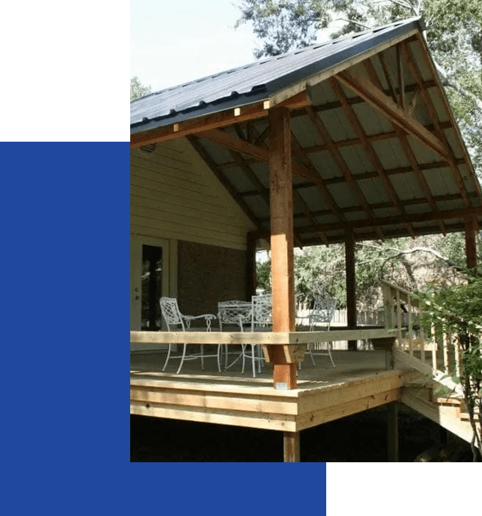 A wooden deck with chairs and tables on it.