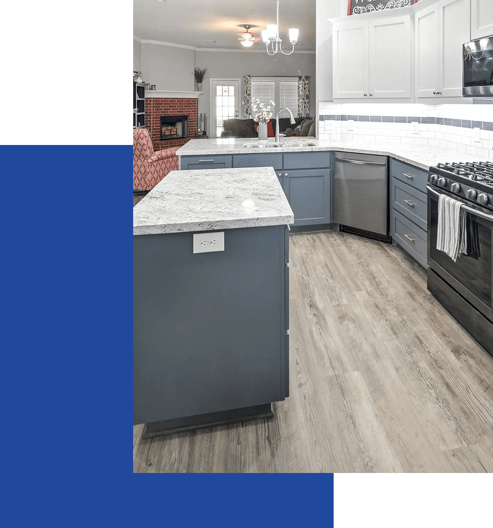 A kitchen with blue and green walls, black cabinets and white counter tops.