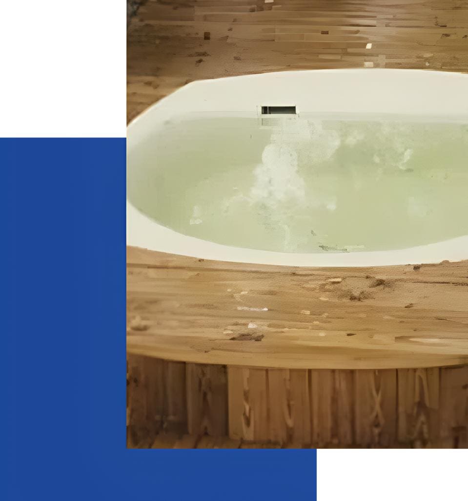 A wooden tub with a white bath in it.